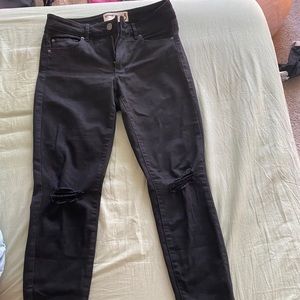 Black jeans with knee rips
